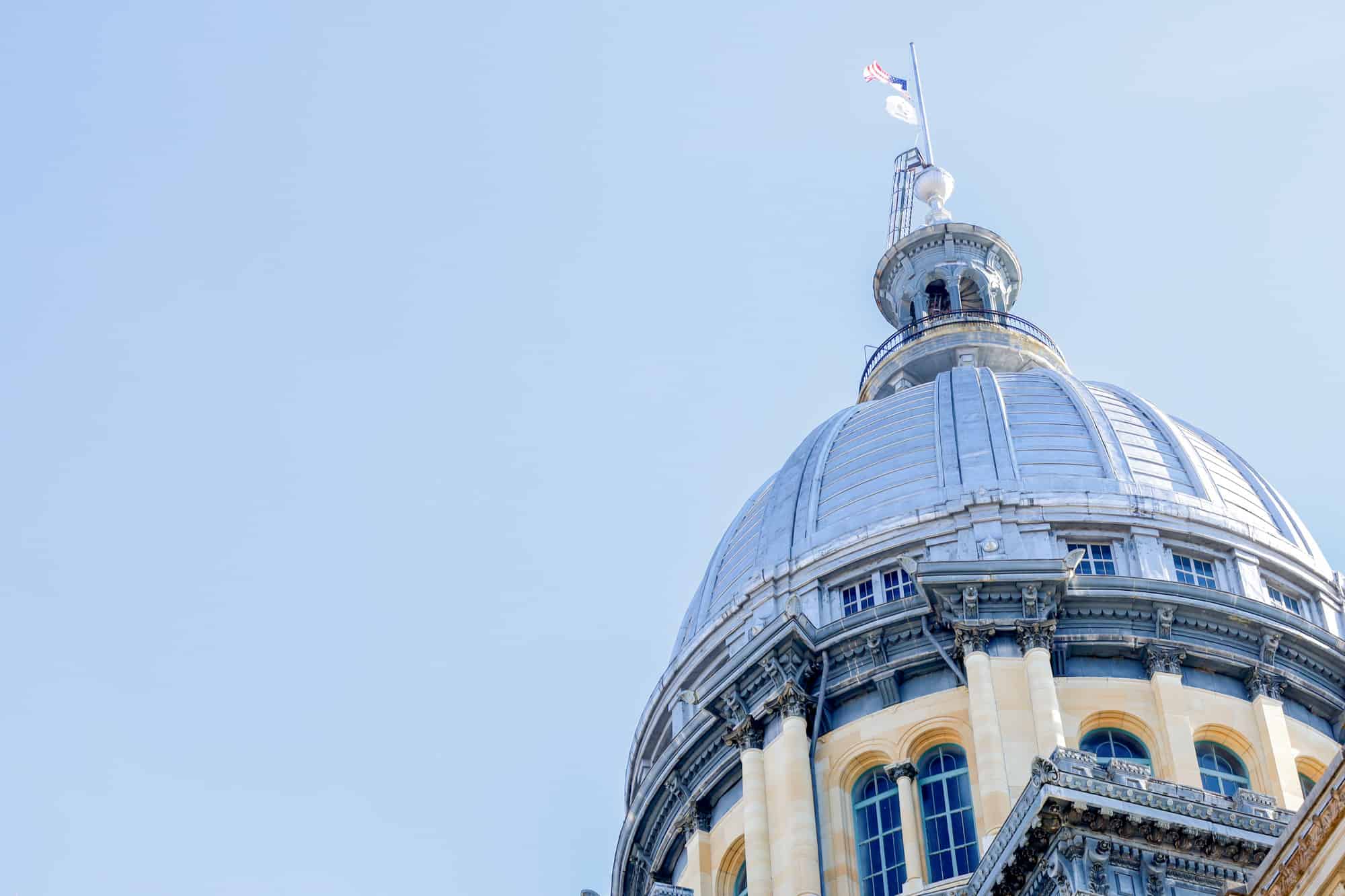 the dome of the springfield, il, capitol with the american flag flying at the top needle, if you are visiting the breweries in springfield, il, leave some time to see the capitol buillding and this beautiful dome