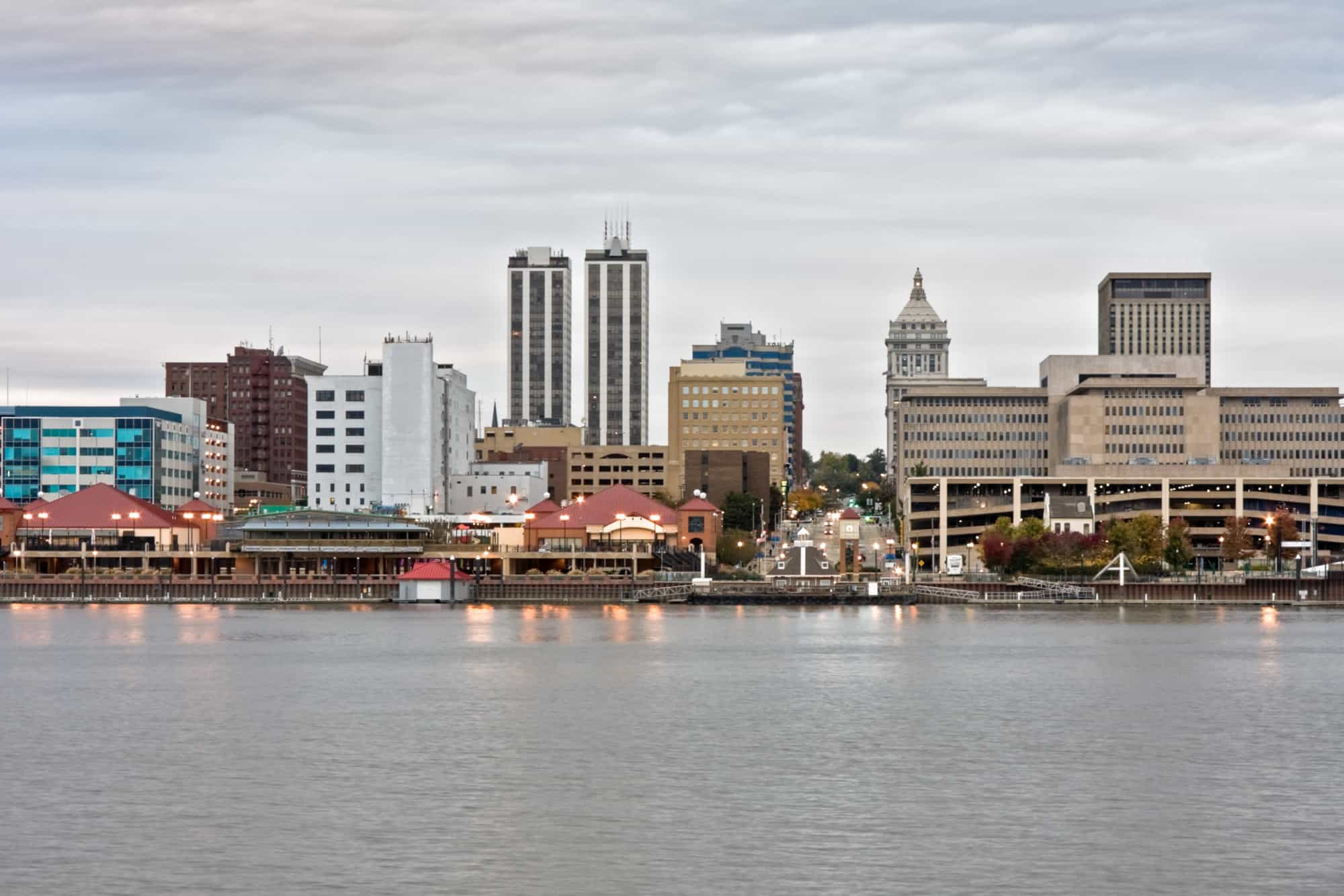 a riverfront view of downtown, with the river in the foreground and the city of peoria along the skyline