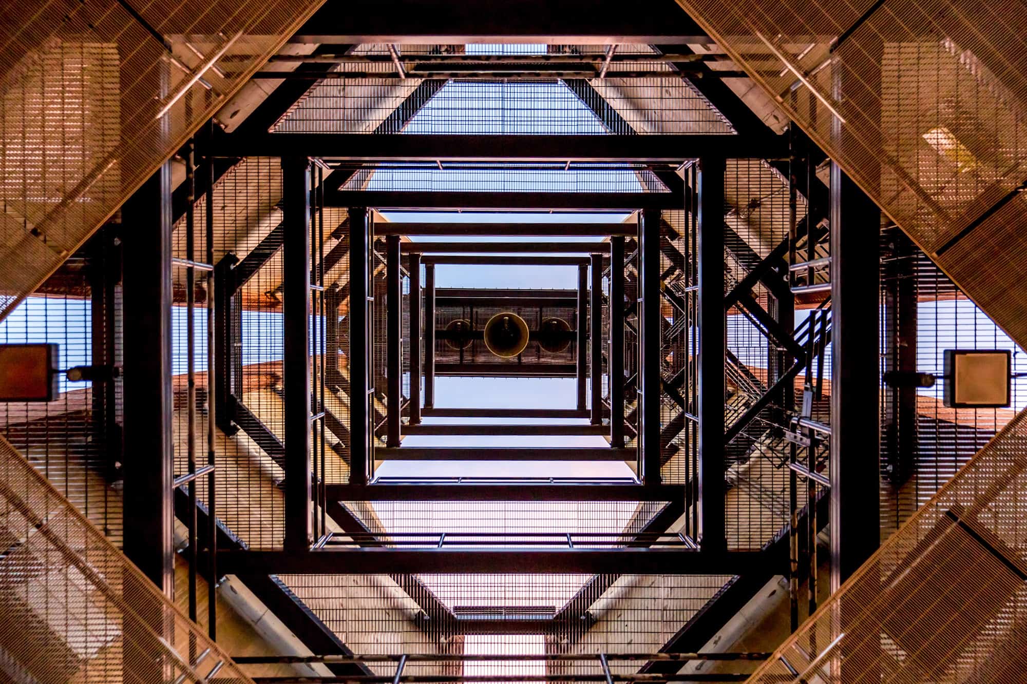 a view up inside a glass building at the university of illinois, the metal beams in rectangular shapes creating a geometric pattern in the image